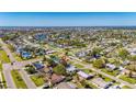 Wide aerial view of a residential neighborhood with waterfront access and mature trees at 564 Florida S Cir, Apollo Beach, FL 33572