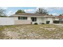 Lovely single-story home has a well-kept lawn, neutral paint, and an attached garage for convenience at 7740 Bracken Dr, Port Richey, FL 34668