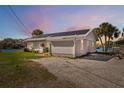 Charming single-story home with solar panels on the roof and water views at 9017 Petal Ct, Hudson, FL 34667