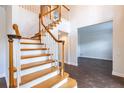 Bright foyer features a wood staircase with white risers and an open floorplan at 9608 Norchester Cir, Tampa, FL 33647