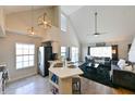 Bright kitchen featuring pendant lighting, stainless steel appliances, and an island with seating at 9730 Lake Chase Island Way # 9730, Tampa, FL 33626