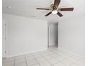 Spacious living room featuring neutral paint, tile floors, and a ceiling fan at 1225 Harvest Home Ct, Ruskin, FL 33570