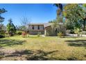 Well-manicured front yard with flourishing plants that enhance the curb appeal of the home at 2903 Oak Crest Dr, Plant City, FL 33565