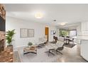 Bright living room featuring modern furniture, a red brick fireplace, and access to a screened patio at 360 22Nd Ne Ave, St Petersburg, FL 33704
