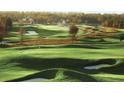 Picturesque golf course featuring rolling green hills and sand traps at 5047 Summit View Dr, Brooksville, FL 34601