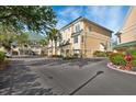 Beautiful condo with a green roof, complemented by lush landscaping and a private garage at 6327 Sunset Bay Cir, Apollo Beach, FL 33572