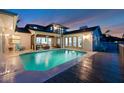 Back of house featuring swimming pool, patio, and screened-in porch at 6606 Dolphin Cove Dr, Apollo Beach, FL 33572