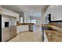 Modern kitchen featuring stainless steel appliances and granite countertops at 6805 Winslow St, Sarasota, FL 34243