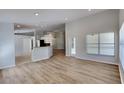 Bright living room with new floors, recessed lighting and neutral paint at 6805 Winslow St, Sarasota, FL 34243
