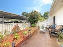 Cozy patio space features beautiful plants and comfortable seating area at 1655 S Highland Ave # G164, Clearwater, FL 33756