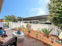 Relaxing outdoor patio with well-manicured landscaping and covered parking view at 1655 S Highland Ave # G164, Clearwater, FL 33756