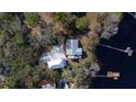 An aerial view of the property showing its proximity to the lake and the large lot at 16573 Hutchison Rd, Odessa, FL 33556