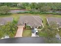 Sprawling single-Gathering home with a large lot, mature trees, and a two-car garage with ample parking at 2243 Worthington Greens Dr, Sun City Center, FL 33573