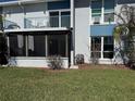 Image of a condo with a screened in patio and balcony at 329 Medallion Blvd # C, Madeira Beach, FL 33708