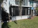 Image of a condo with a screened in patio and balcony at 329 Medallion Blvd # C, Madeira Beach, FL 33708