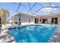 Relaxing screened-in pool with plenty of room for outdoor living and entertaining at 4823 Deer Lodge Rd, New Port Richey, FL 34655