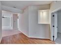 Bright, open living area with hardwood floors, neutral paint and a recessed display alcove at 6432 Twin Bridges Dr, Zephyrhills, FL 33541