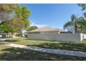 A sprawling backyard with a privacy fence encloses the property, offering ample space and seclusion at 11749 Summer Springs Dr, Riverview, FL 33579