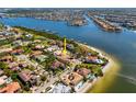 Luxury waterfront property with beach access and lush landscaping, located in a desirable coastal community at 1314 Jumana Loop, Apollo Beach, FL 33572