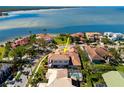 Stunning waterfront home with a private pool and lush landscaping, offering breathtaking views of the bay at 1314 Jumana Loop, Apollo Beach, FL 33572