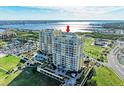 Striking exterior elevation of the condominium building with beautiful views of the marina at 140 Riviera Dunes Way # 404, Palmetto, FL 34221