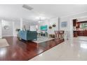 Open-concept living room with hardwood floors, stylish furniture, and plenty of natural light at 16 N Saturn Ave, Clearwater, FL 33755