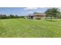 Expansive backyard provides lots of room and features a screened in lanai at 30142 Sotogrande Loop, Wesley Chapel, FL 33543