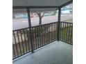 Relax on this charming balcony with black metal railings overlooking a busy street at 3801 N Oak Dr # A62, Tampa, FL 33611
