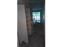 Living room with sliding glass door, ceiling fan, and boxes of flooring material at 3801 N Oak Dr # A62, Tampa, FL 33611