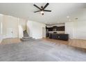 Spacious layout with an open kitchen, cozy living area, and staircase, and ample natural light at 5955 Sweet Birch Dr, Riverview, FL 33578
