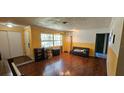 Bright living room with hardwood floors and a large window providing ample natural light at 5998 8Th S St, St Petersburg, FL 33705