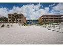 Charming beachfront home with a white picket fence and stunning views of the sandy beach at 614 Gulf Blvd # 4, Indian Rocks Beach, FL 33785