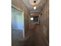 Hallway view showcasing neutral paint and carpet throughout the home at 8530 Alexandra Arbor Ln, Temple Terrace, FL 33637