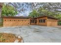 Exterior of this stylish residence with concrete drive and unique facade, adding to its modern charm and curb appeal at 1301 45Th N Ave, St Petersburg, FL 33703