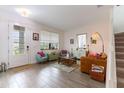 Beautifully staged living room with tiled floors, comfortable seating, and stylish decor at 15041 Sea Salt Way, Bradenton, FL 34211