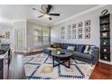 Comfortable living room with gray sofa, stylish ceiling fan, and decorative rug at 1810 E Palm Ave # 4304, Tampa, FL 33605