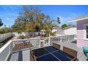 The backyard patio offers an outdoor dining area with a glass-top table at 1874 N Washington Ave, Clearwater, FL 33755