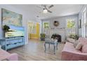 Bright living room with fireplace and multiple windows provide ample natural light at 1874 N Washington Ave, Clearwater, FL 33755