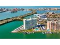 Stunning high rise aerial view showcases pristine waterfront living with easy access to the city at 31 Island Way # 106, Clearwater Beach, FL 33767