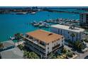 Aerial view of a condo building with waterfront access and a stunning view of the marina at 479 E Shore Dr # 8, Clearwater, FL 33767