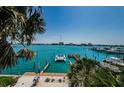 Stunning waterfront view framed by palm trees, showcasing the turquoise water and surrounding cityscape at 479 E Shore Dr # 8, Clearwater, FL 33767