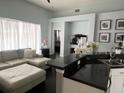 Comfortable living room area featuring an island countertop and view into another room at 5229 Clover Mist Dr, Apollo Beach, FL 33572