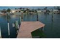 Private dock providing easy access to the water, perfect for boating, fishing, and enjoying waterfront living at 780 116Th Ave, Treasure Island, FL 33706