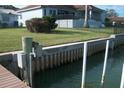 A beautiful waterfront view with a seawall and a private dock for enjoying waterfront activities at 780 116Th Ave, Treasure Island, FL 33706