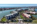 Expansive aerial view of waterfront condos, lush landscapes, fountains, and scenic waterways at 7963 Sailboat Key Blvd # 601, St Pete Beach, FL 33707