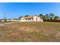 Charming single-story home featuring a well-maintained lawn and attached two-car garage at 13191 Siam Dr, Spring Hill, FL 34609