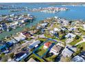 Stunning aerial view of the property's desirable waterfront community, showcasing its location near the water at 15822 Redington Dr, Redington Beach, FL 33708