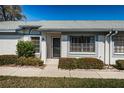 Charming villa with manicured landscaping and inviting entryway at 2749 Countryside Blvd # 28, Clearwater, FL 33761