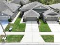 A beautiful aerial view of this lovely single-Gathering home with a well-manicured lawn and a two car garage at 31818 Blythewood Way, Wesley Chapel, FL 33543