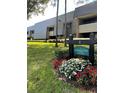 Well-maintained condo building with professional landscaping and updated facade at 36750 Us Highway 19 N # 3-210, Palm Harbor, FL 34684